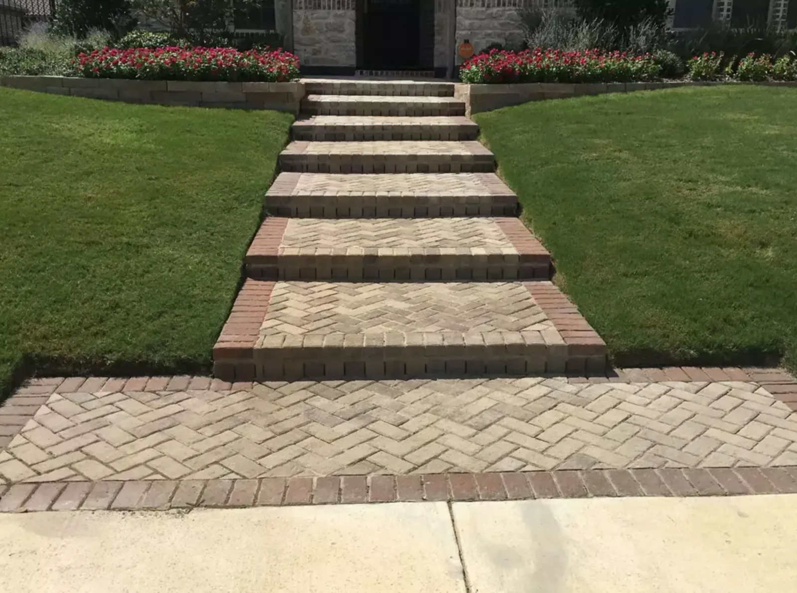 Finished paver steps and walkway illuminated at dusk